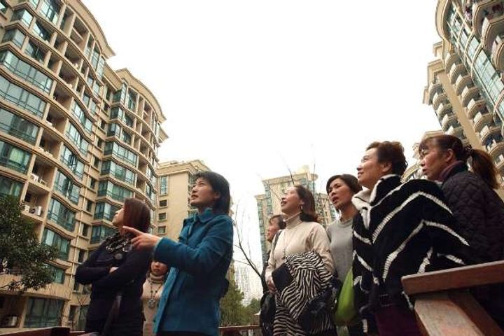 China's Housing Boom Gives Birth to an Army of 'Wife Flippers' 