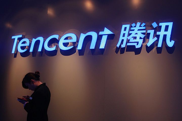 Tencent's Shares Slide Further After First Profit Dip for at Least a Decade