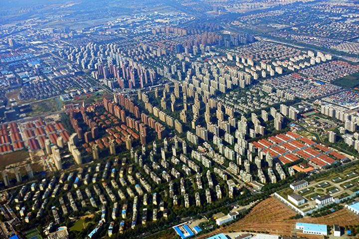 Chinese Real Estate Firms Eye Bargains After Poor Year of Land Sales
