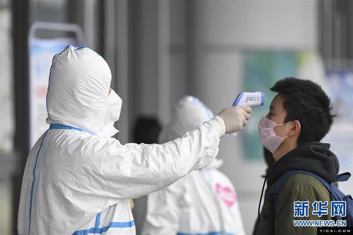China's Transport Hubs Ramp Up Disease Control as Extended Holiday Comes to Close