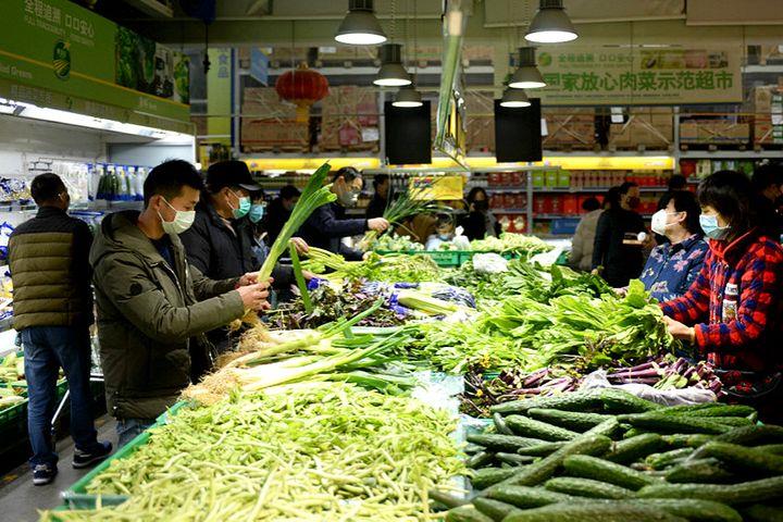 China's Consumer Inflation Cooled in March as Food Prices Fell