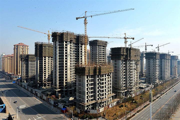 Chinese Property Developers Warn of First-Half Losses