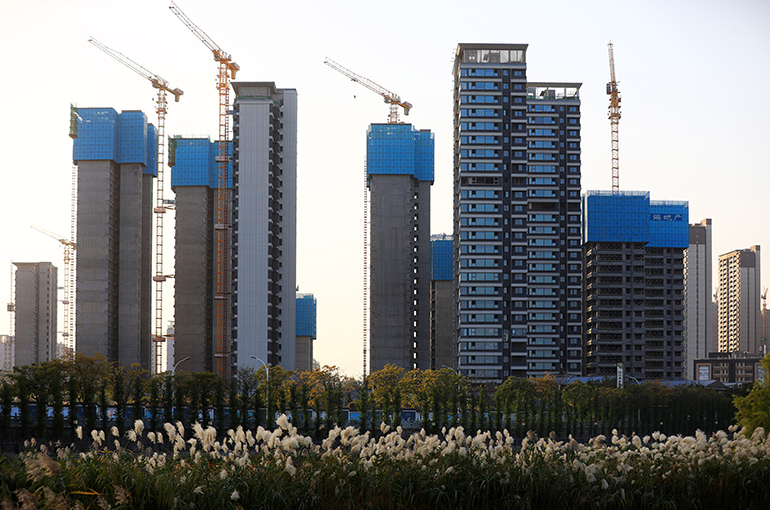 Wealthy Chinese Firms Go Bargain Hunting in China's Stagnant Property Market