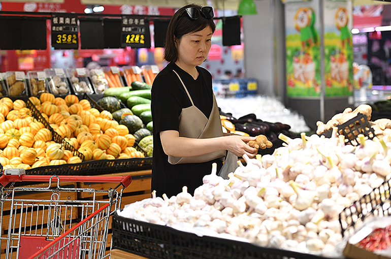 China’s March Inflation Braked on Cheaper Food, Travel